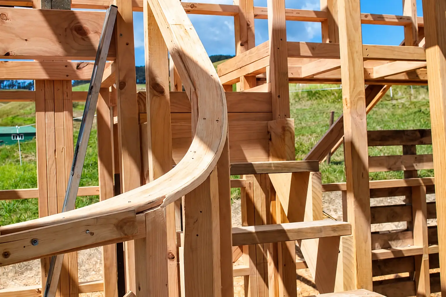 Curved sustainably sourced timber framing on a New Zealand building site