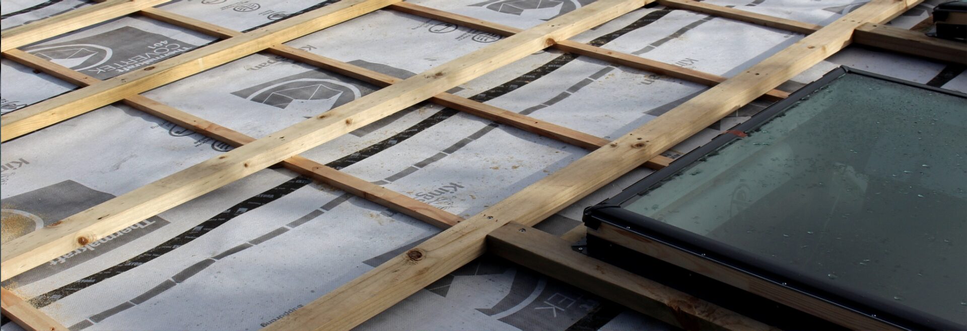 Building wrap and skylights during a Waiheke reclad